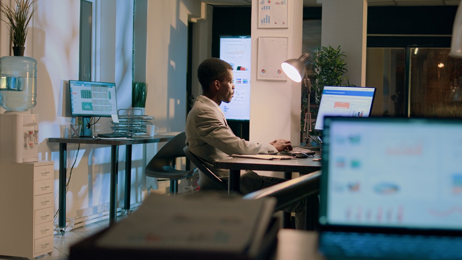 Coworkers auditing payroll reports